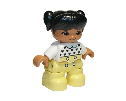 Duplo Figure Lego Ville, Child Girl, Bright Light Yellow Legs, White Top with Black Hearts, Black Hair with Pigtails, Medium Nougat Skin Image